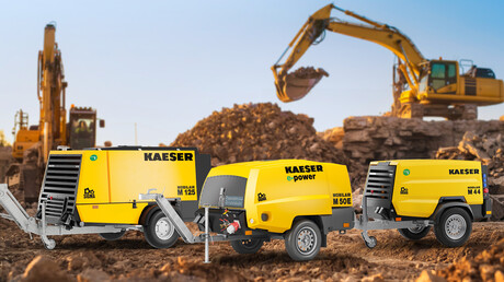 Three portable compressed air compressors – M125, M50E and M44 – in operation on the construction site.